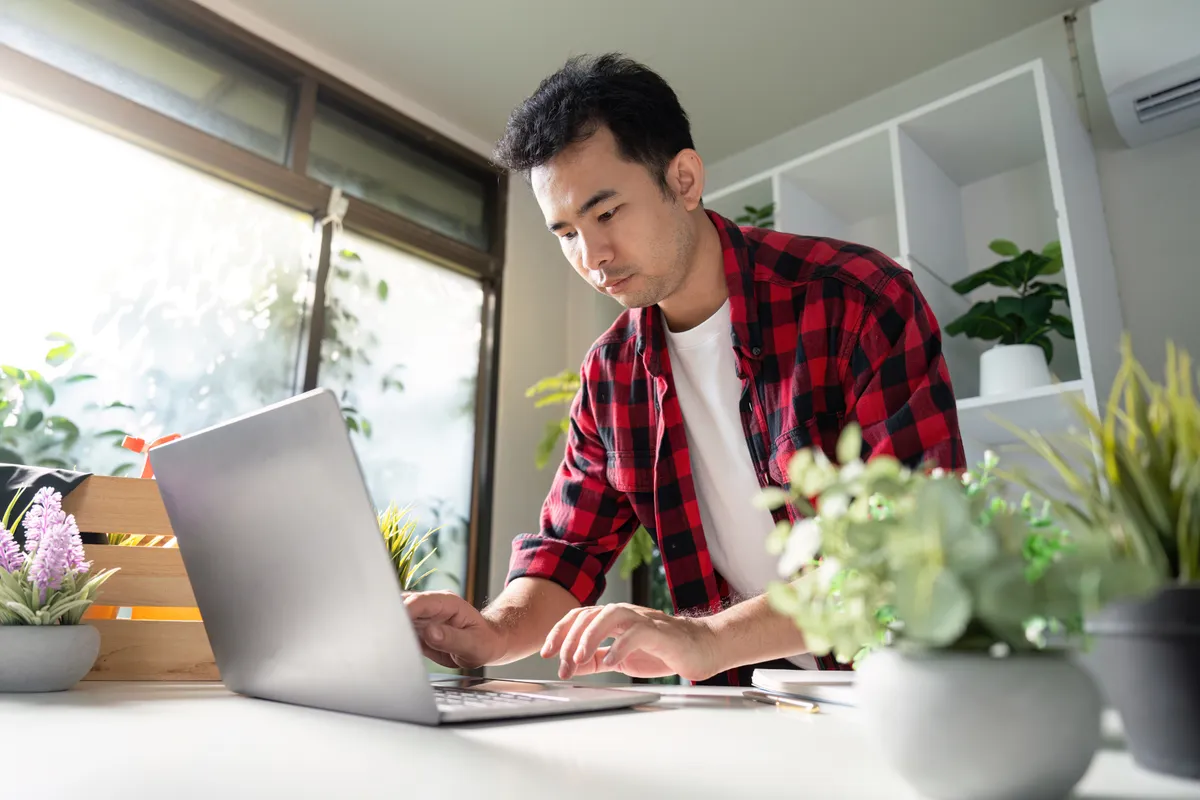 Independent contractor reviewing 1099 earnings statements at a desk