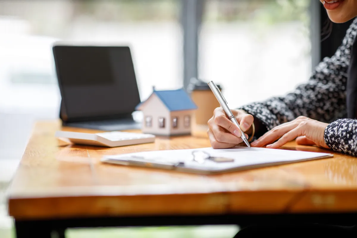 Investor signing entity documents for a rental property purchase